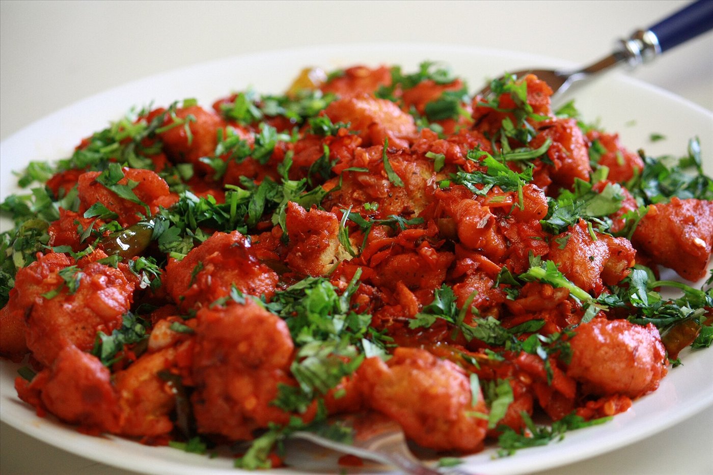 Chicken 65, crisp red fried chicken pieces with curry leaves