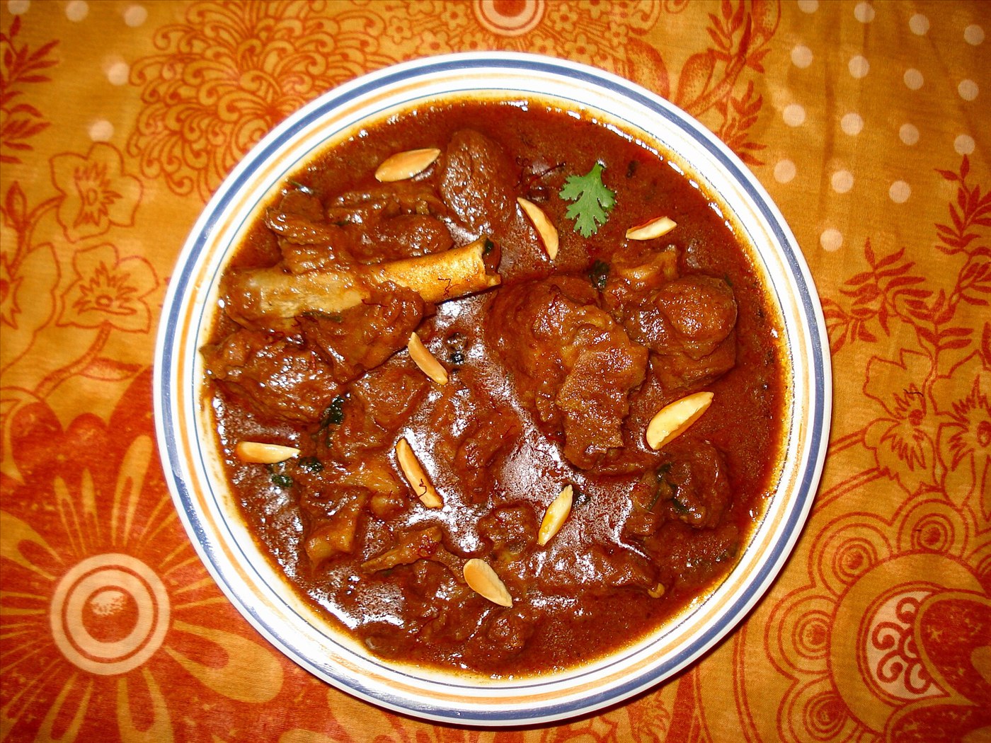 Rogan josh lamb curry in a deep red spiced gravy